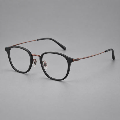 Retro soft square eyeglasses in acetate and titanium with a curved bridge and slender temples in Matte Black / Antique Copper, three quarter view additional product view