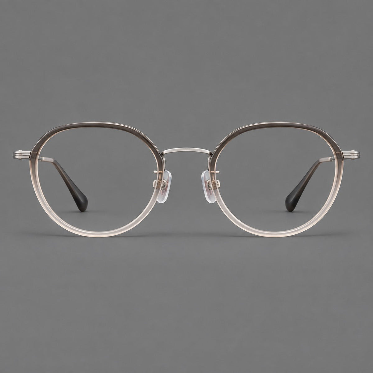 Rounded eyeglasses in acetate and titanium with gently arched brows and engraved metal temples in Mist Gray Gradient / Silver, front view