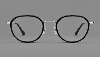 Rounded eyeglasses in acetate and titanium with gently arched brows and engraved metal temples in Black / Silver, front view additional product view