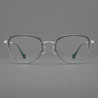 Upswept eyeglasses in acetate and titanium with softly rounded rims and tapered metal temples in Clear Green / Silver, front view side view