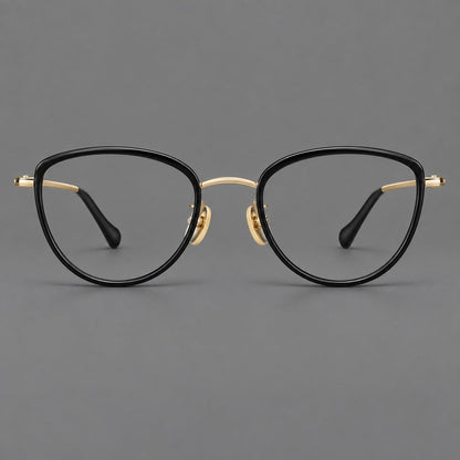 Upswept eyeglasses in acetate and titanium with softly rounded rims and tapered metal temples in Black / Gold, front view additional product view