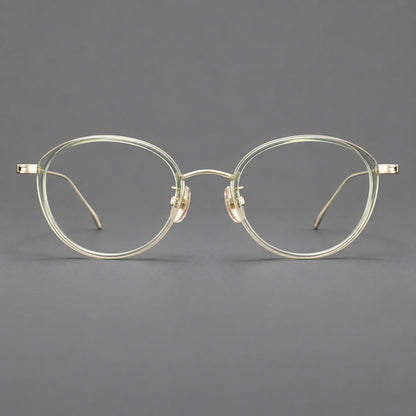 Round eyeglasses in acetate and titanium with a slim curved bridge and fine metal temples in Green / Gold, front view side view