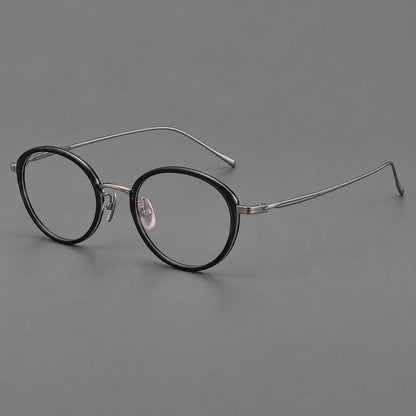 Round eyeglasses in acetate and titanium with a slim curved bridge and fine metal temples in Glossy Black / Gunmetal, three quarter view additional product view