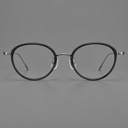 Round eyeglasses in acetate and titanium with a slim curved bridge and fine metal temples in Glossy Black / Gunmetal, front view additional product view