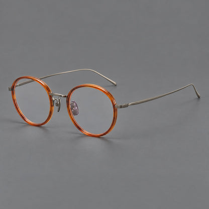 Classic round eyeglasses in acetate and titanium with slim rims and textured metal temples in Tea Brown / Gunmetal, three quarter view