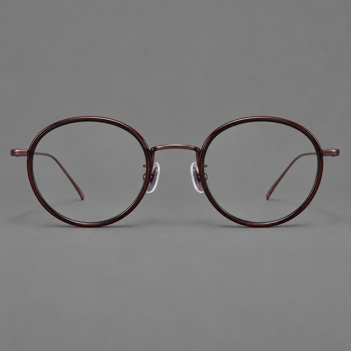 Classic round eyeglasses in acetate and titanium with slim rims and textured metal temples in Glossy Black / Wine Red, front view