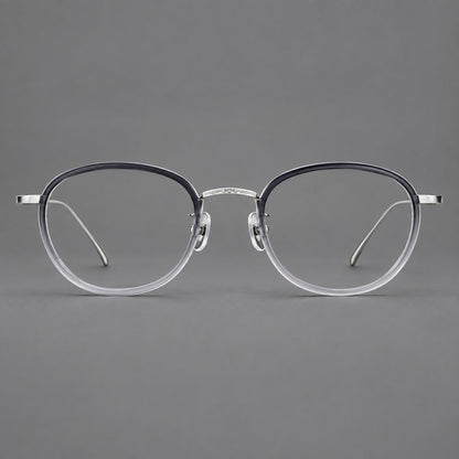 Vintage round eyeglasses in acetate and titanium with an engraved bridge and slender temples in Gray Gradient / Silver, front view frame detail
