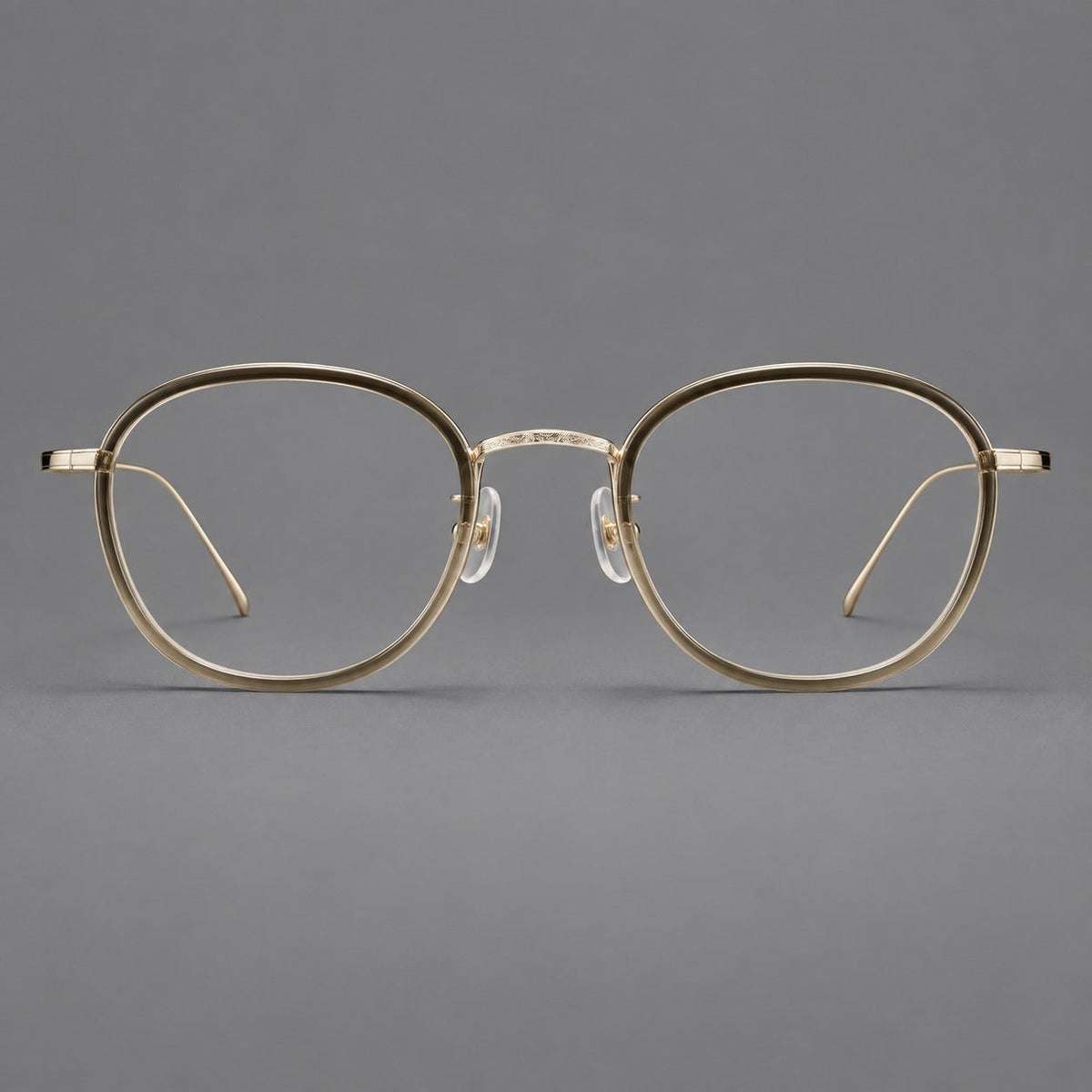 Vintage round eyeglasses in acetate and titanium with an engraved bridge and slender temples in Tea Gradient / Light Gold, front view