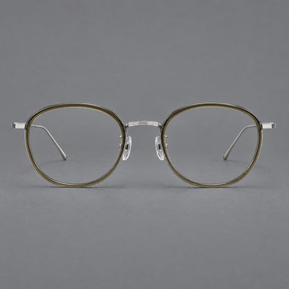 Vintage round eyeglasses in acetate and titanium with an engraved bridge and slender temples in Tea Green / Matte Silver, front view additional product view