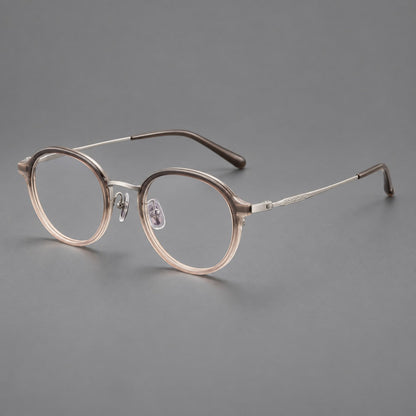 Softly rounded eyeglasses in acetate and titanium with a curved bridge and engraved temples in Tea Pink Gradient / Silver, three quarter view lens detail