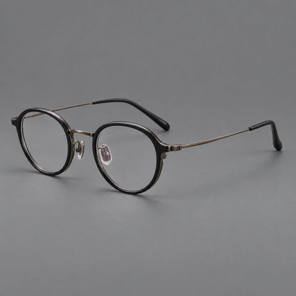 Softly rounded eyeglasses in acetate and titanium with a curved bridge and engraved temples in Matte Black / Antique Copper, three quarter view additional product view
