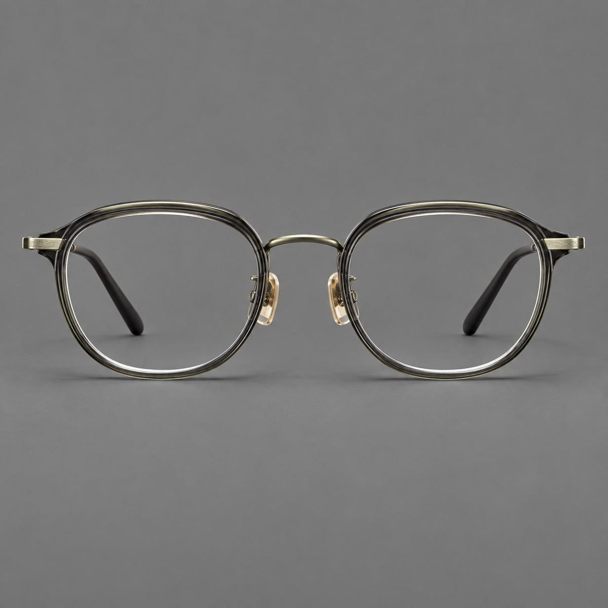 Soft square eyeglasses in acetate and titanium with rounded corners and decorative metal temples in Ice Gray Tortoiseshell / Antique Gold, front view