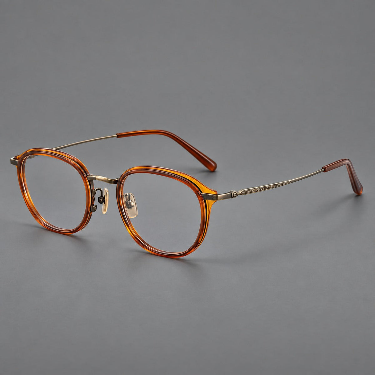 Soft square eyeglasses in acetate and titanium with rounded corners and decorative metal temples in Brown Tortoiseshell / Antique Gold, three quarter view