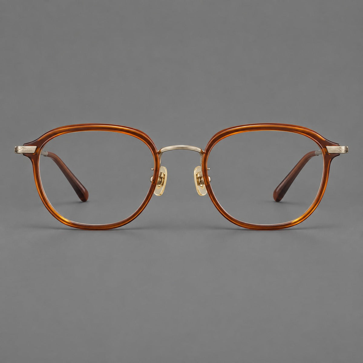 Soft square eyeglasses in acetate and titanium with rounded corners and decorative metal temples in Brown Tortoiseshell / Antique Gold, front view
