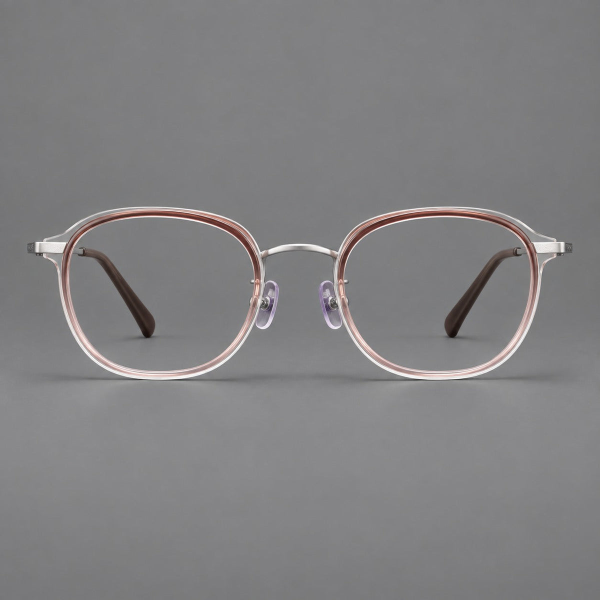 Soft square eyeglasses in acetate and titanium with rounded corners and decorative metal temples in Clear Tea Gradient / Silver, front view
