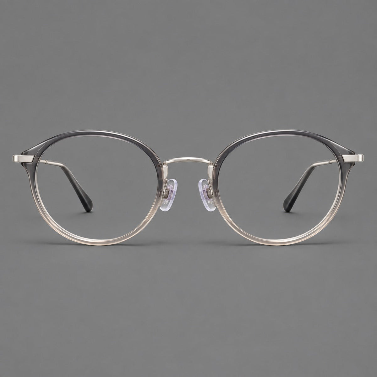 Retro panto eyeglasses in acetate and titanium with an arched bridge and engraved metal temples in Gray Green Gradient / Silver, front view