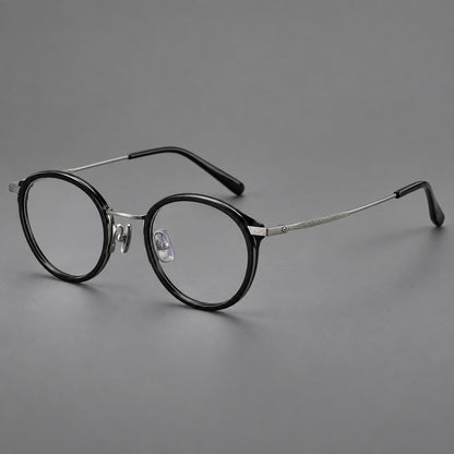 Retro panto eyeglasses in acetate and titanium with an arched bridge and engraved metal temples in Glossy Black / Matte Gunmetal, three quarter view additional product view