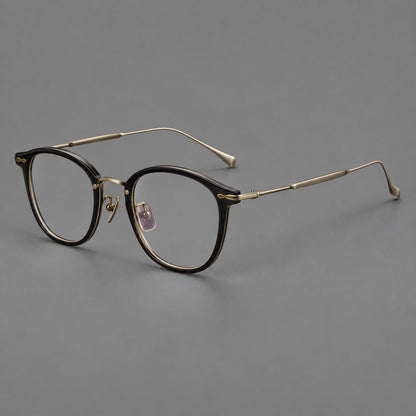 Panto eyeglasses in acetate and titanium with curved brows and decorative metal corner accents in Glossy Black / Antique Bronze, three quarter view additional product view