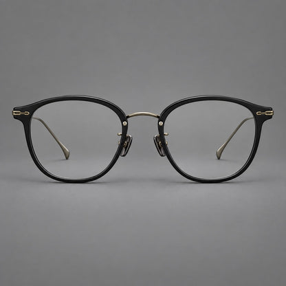 Panto eyeglasses in acetate and titanium with curved brows and decorative metal corner accents in Glossy Black / Antique Bronze, front view additional product view
