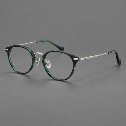 Vintage panto eyeglasses in acetate and titanium with raised brows and textured metal temples in Peacock Blue / Silver, three quarter view front view