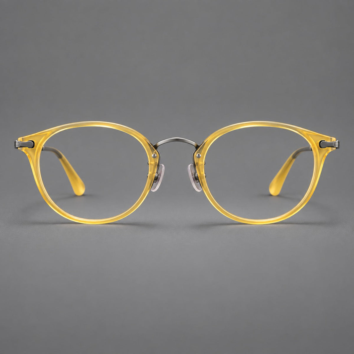 Vintage panto eyeglasses in acetate and titanium with raised brows and textured metal temples in Lemon Yellow / Gunmetal, front view