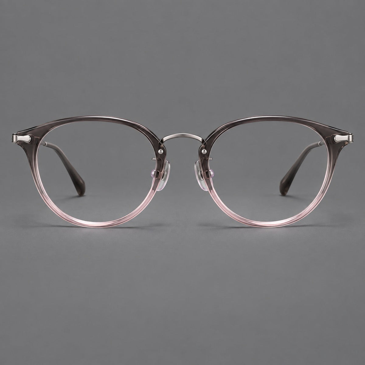 Vintage panto eyeglasses in acetate and titanium with raised brows and textured metal temples in Mist Pink Gradient / Gunmetal, front view