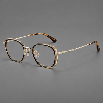 Rounded square eyeglasses in acetate and titanium with an arched bridge and engraved temples in Black and Clear Tea / Light Gold, three quarter view lens detail