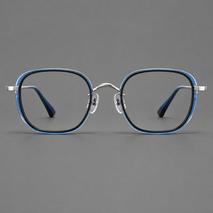 Rounded square eyeglasses in acetate and titanium with an arched bridge and engraved temples in Black and Clear Blue / Silver, front view additional product view