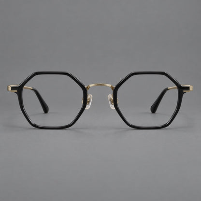 Geometric eyeglasses in acetate and titanium with octagonal rims and a textured metal bridge in Glossy Black / Antique Gold, front view temple detail