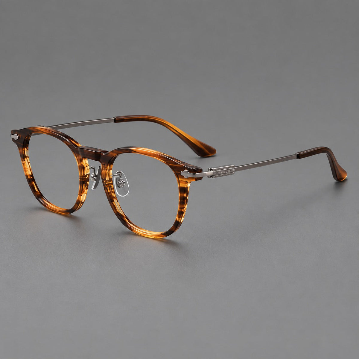 Retro acetate and titanium eyeglasses with soft square rims and sculpted metal corners in Brown Woodgrain / Gray, three quarter view