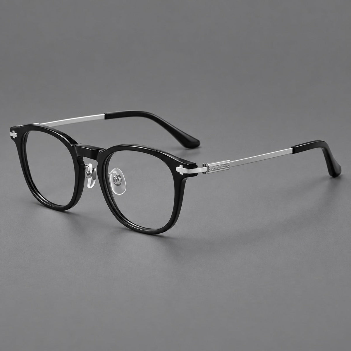 Retro acetate and titanium eyeglasses with soft square rims and sculpted metal corners in Black / Silver, three quarter view