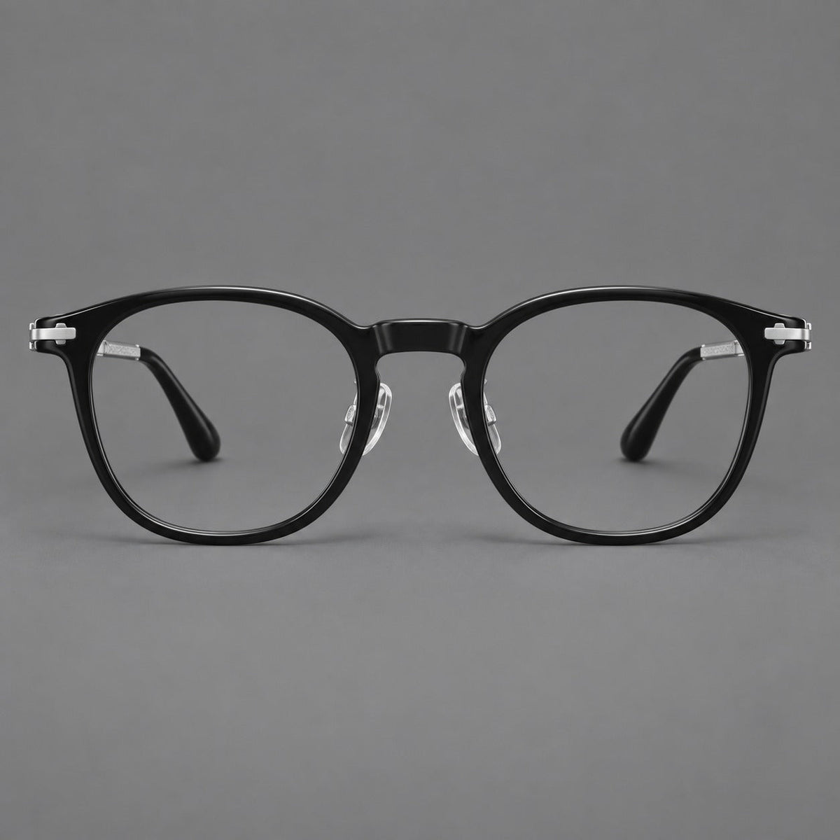 Retro acetate and titanium eyeglasses with soft square rims and sculpted metal corners in Black / Silver, front view