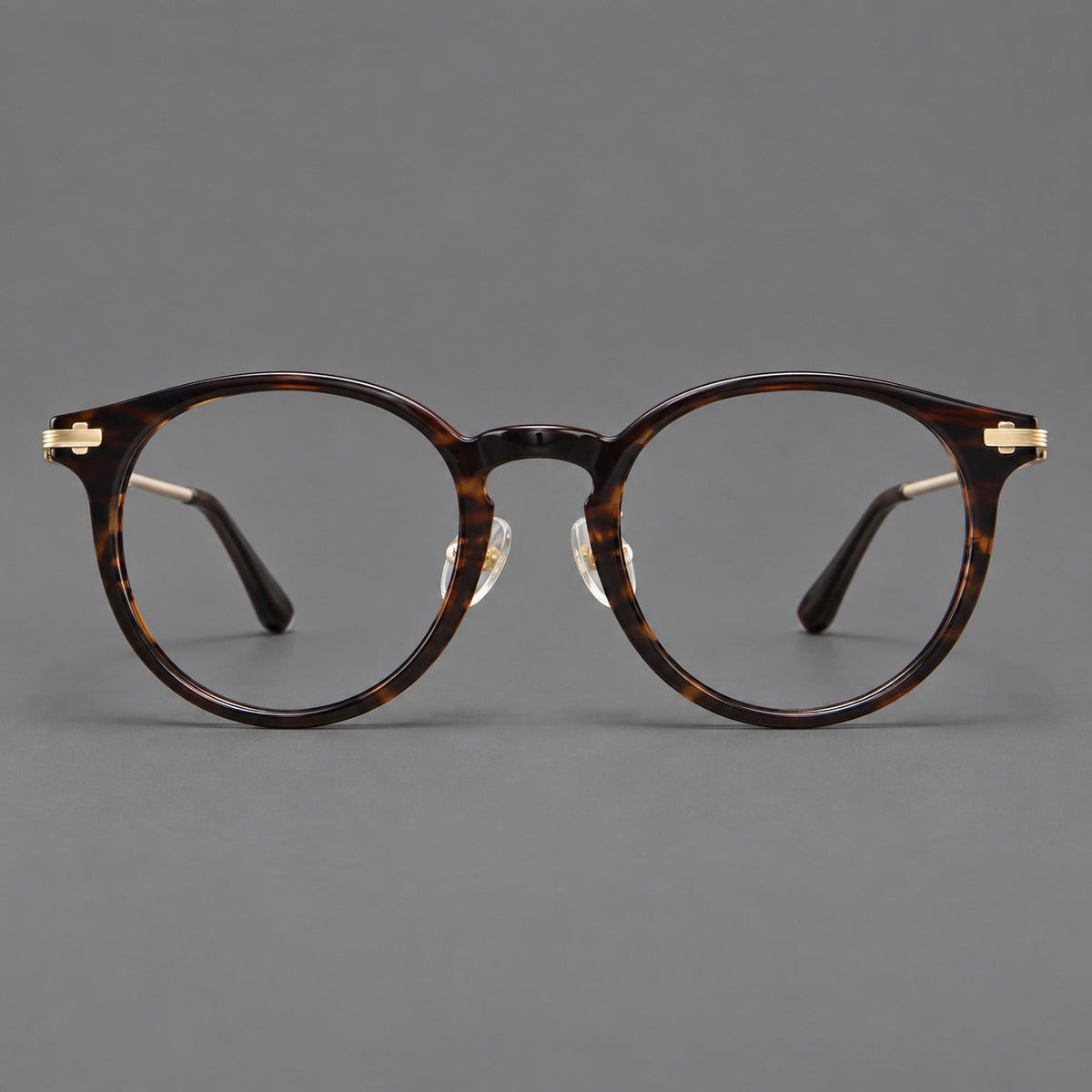 Retro acetate and titanium eyeglasses with round rims and a pronounced keyhole bridge in Brown Woodgrain / Gold, front view