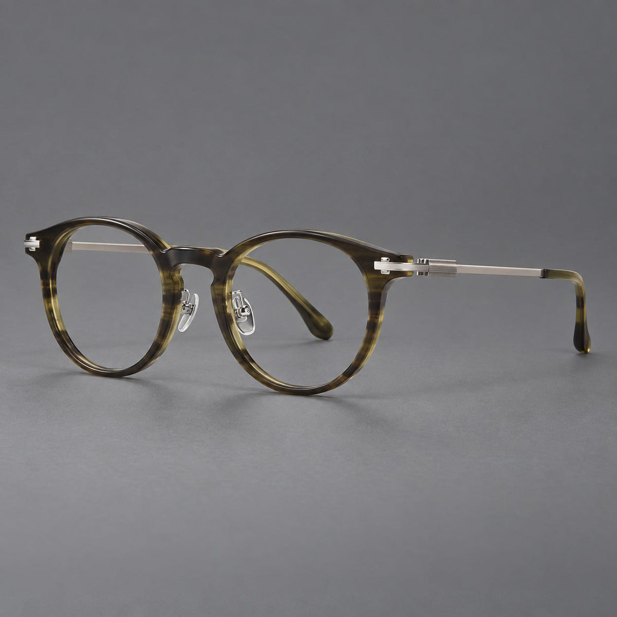 Retro acetate and titanium eyeglasses with round rims and a pronounced keyhole bridge in Olive Woodgrain / Silver, three quarter view