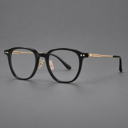 Vintage acetate and titanium eyeglasses with rounded square rims and slotted metal temples in Black / Gold, three quarter view