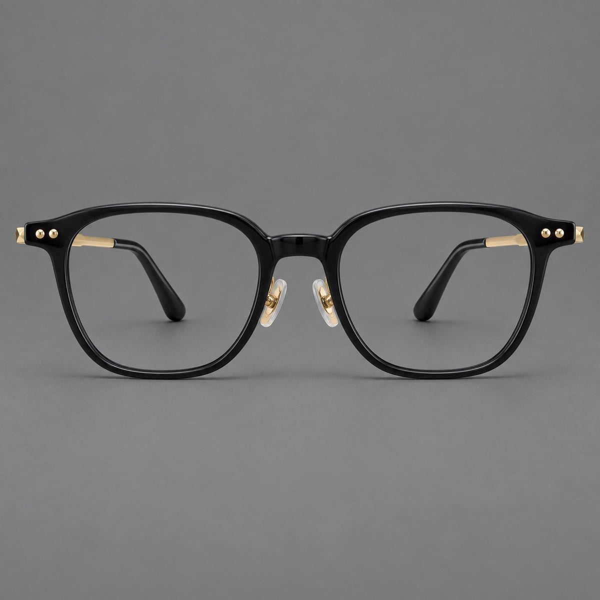 Vintage acetate and titanium eyeglasses with rounded square rims and slotted metal temples in Black / Gold, front view