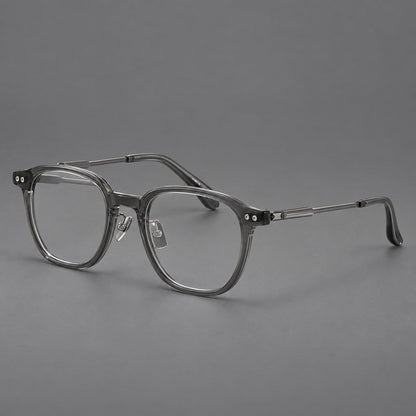 Vintage acetate and titanium eyeglasses with rounded square rims and slotted metal temples in Clear Gray, three quarter view front view