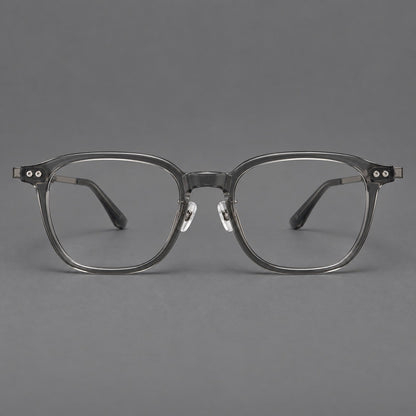 Vintage acetate and titanium eyeglasses with rounded square rims and slotted metal temples in Clear Gray, front view frame detail