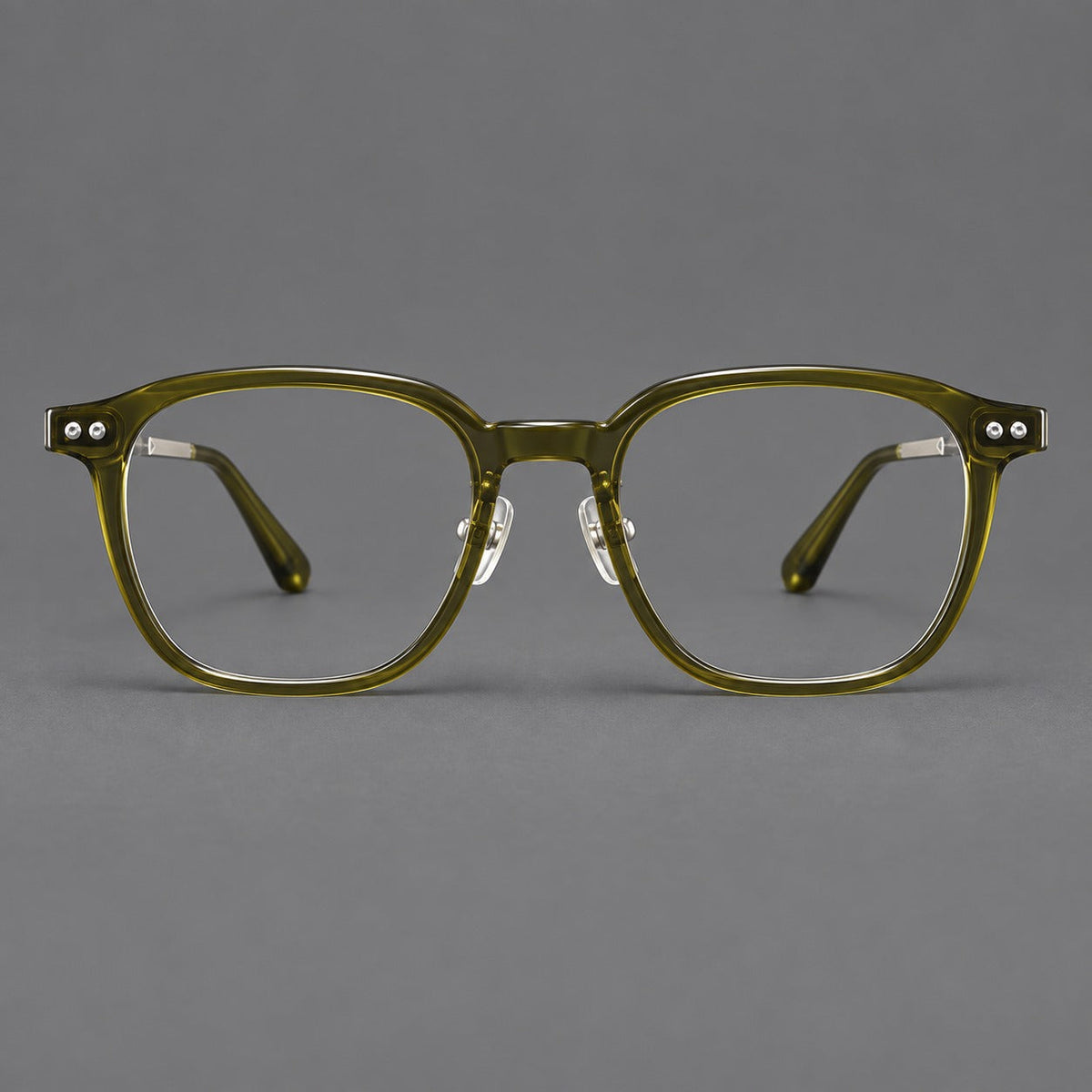 Vintage acetate and titanium eyeglasses with rounded square rims and slotted metal temples in Clear Olive Green / Silver, front view