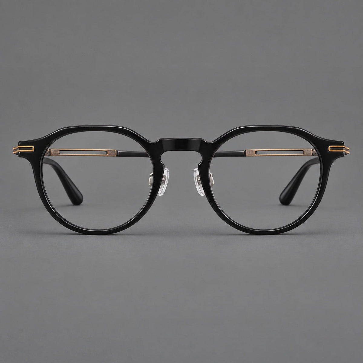 Retro acetate and titanium eyeglasses with round rims and distinctive looped metal joints in Black / Antique Bronze, front view