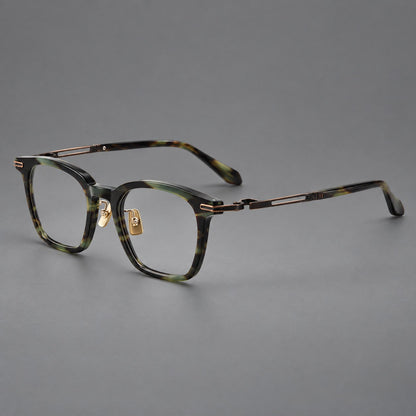 Acetate and titanium eyeglasses with rounded rectangular rims and sculpted open loop joints in Green Tortoiseshell / Antique Bronze, three quarter view