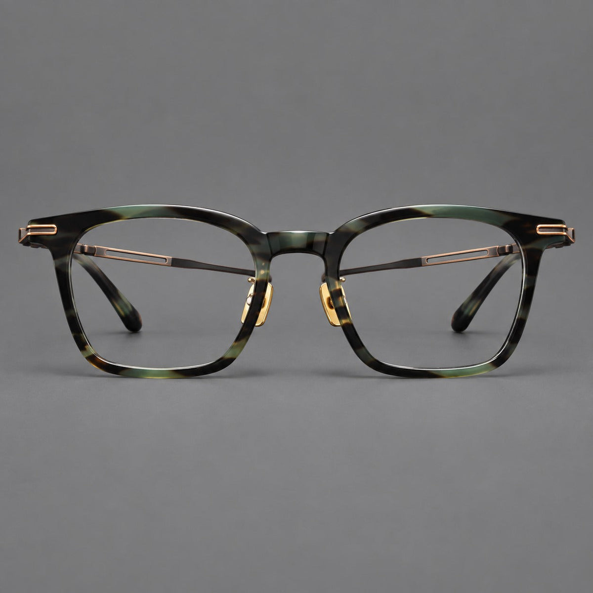 Acetate and titanium eyeglasses with rounded rectangular rims and sculpted open loop joints in Green Tortoiseshell / Antique Bronze, front view