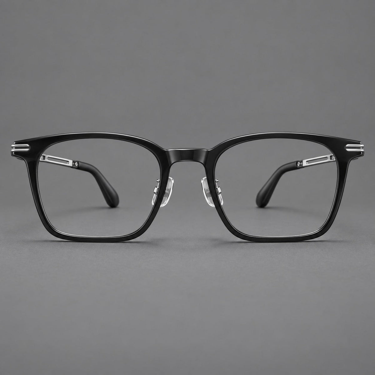 Acetate and titanium eyeglasses with rounded rectangular rims and sculpted open loop joints in Black / Silver, front view