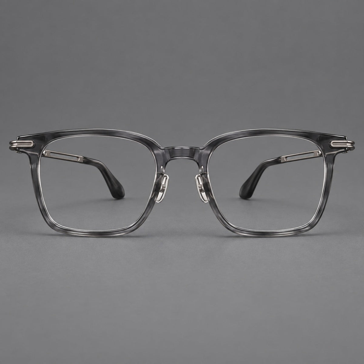 Acetate and titanium eyeglasses with rounded rectangular rims and sculpted open loop joints in Clear Gray / Brushed Gray, front view