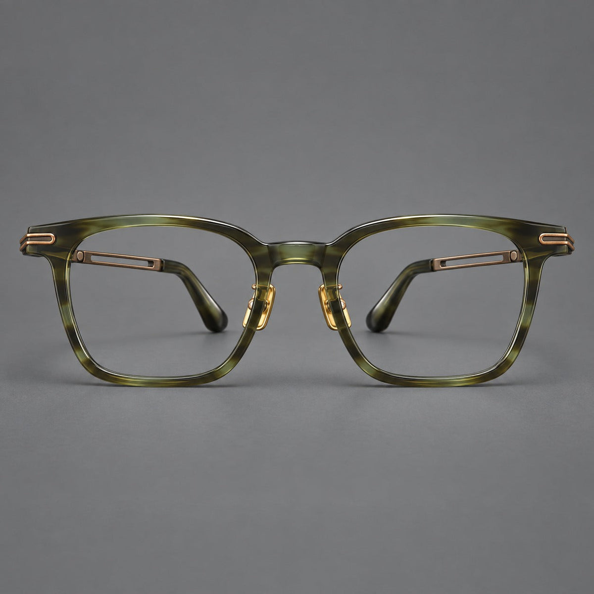 Acetate and titanium eyeglasses with rounded rectangular rims and sculpted open loop joints in Clear Olive Green / Antique Bronze, front view