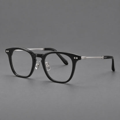 Retro acetate and titanium eyeglasses with gently squared rims and circular metal hinges in Black / Silver, three quarter view front view