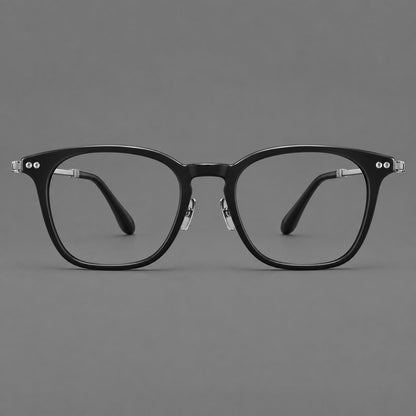Retro acetate and titanium eyeglasses with gently squared rims and circular metal hinges in Black / Silver, front view frame detail