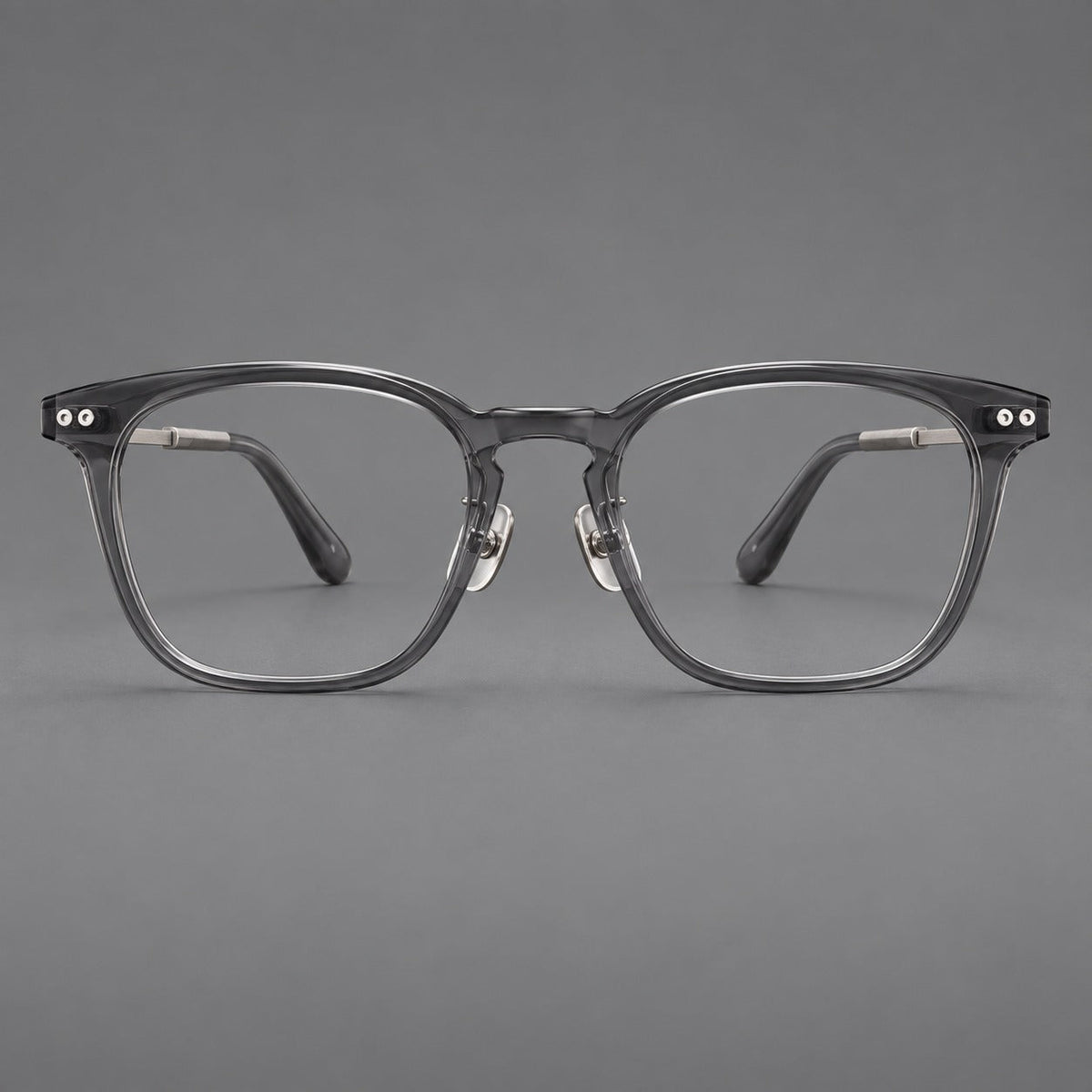 Retro acetate and titanium eyeglasses with gently squared rims and circular metal hinges in Clear Gray / Brushed Gray, front view