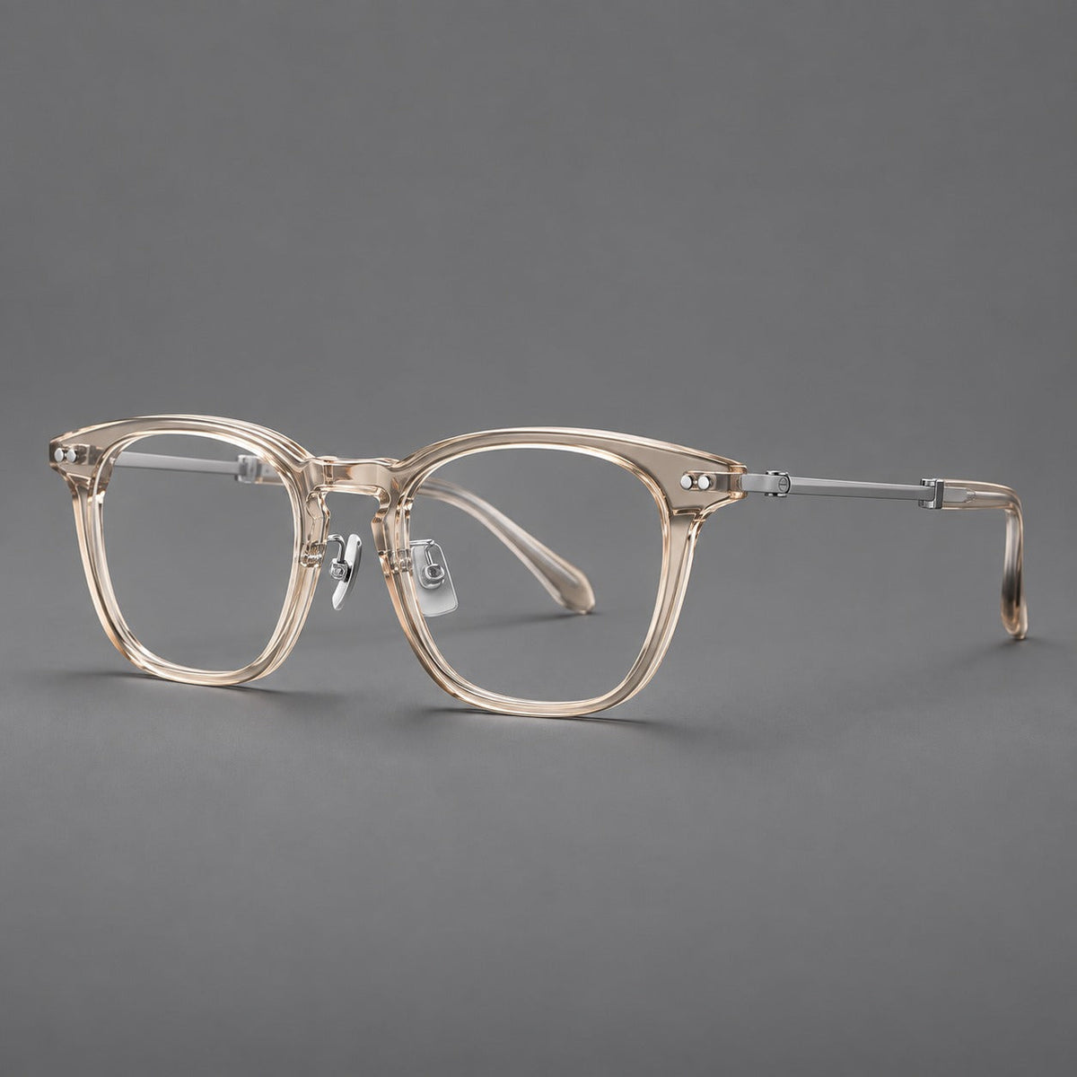 Retro acetate and titanium eyeglasses with gently squared rims and circular metal hinges in Clear Cool Tea / Silver, three quarter view