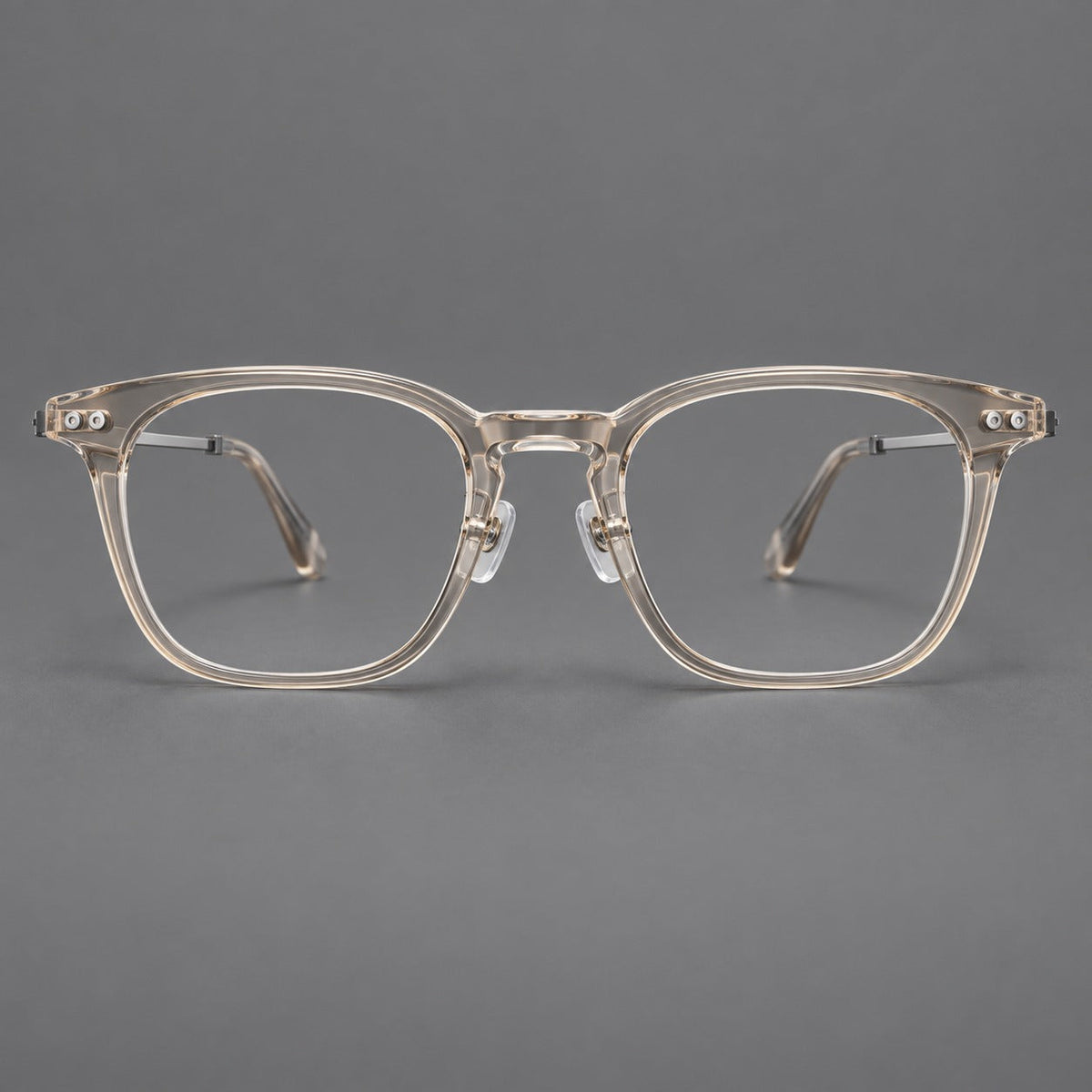 Retro acetate and titanium eyeglasses with gently squared rims and circular metal hinges in Clear Cool Tea / Silver, front view